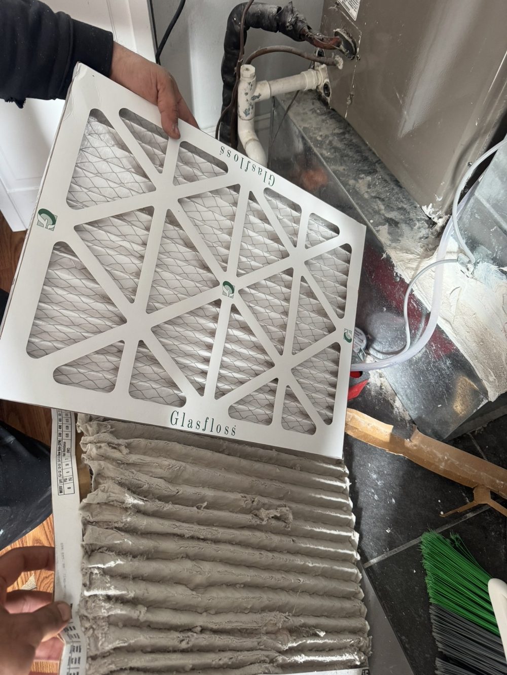 Lumen technician replacing a dirty home air filter with a clean one