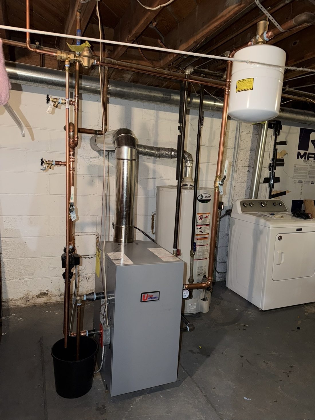 Utica gas boiler and water heater installation in a Philadelphia basement