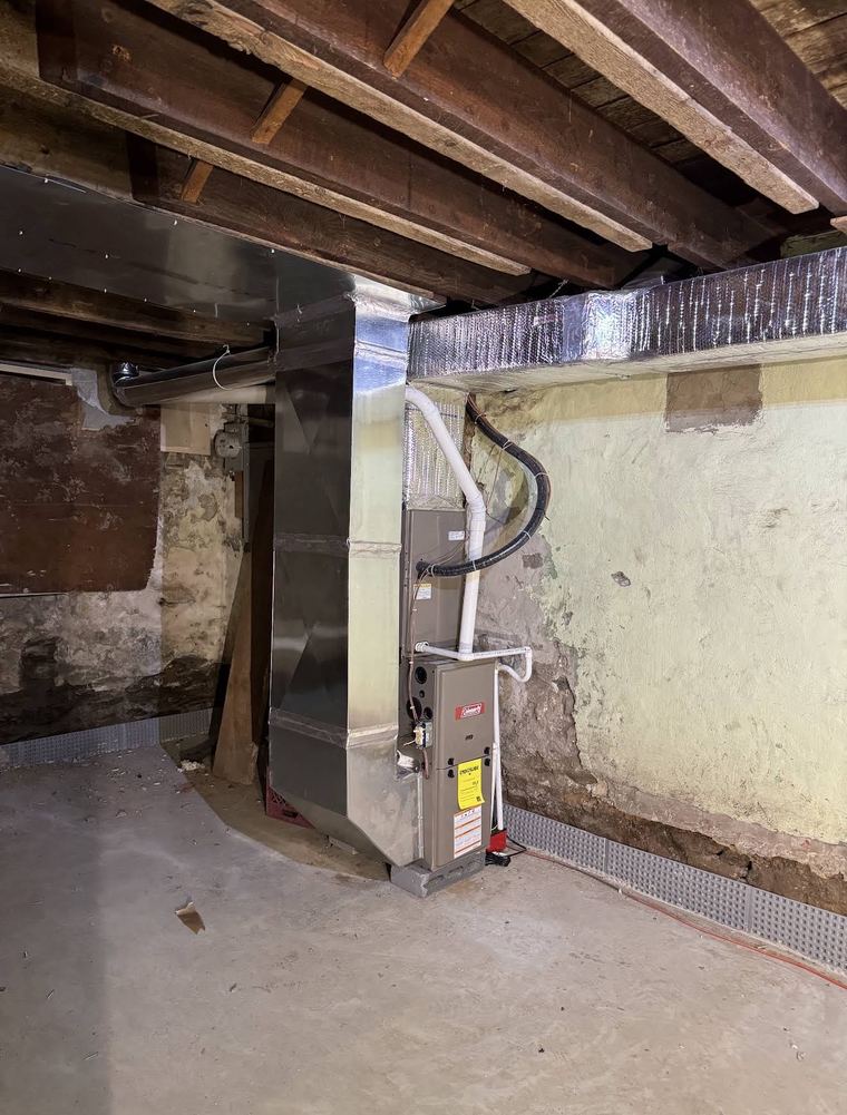 Coleman gas furnace and ductwork installed in a basement
