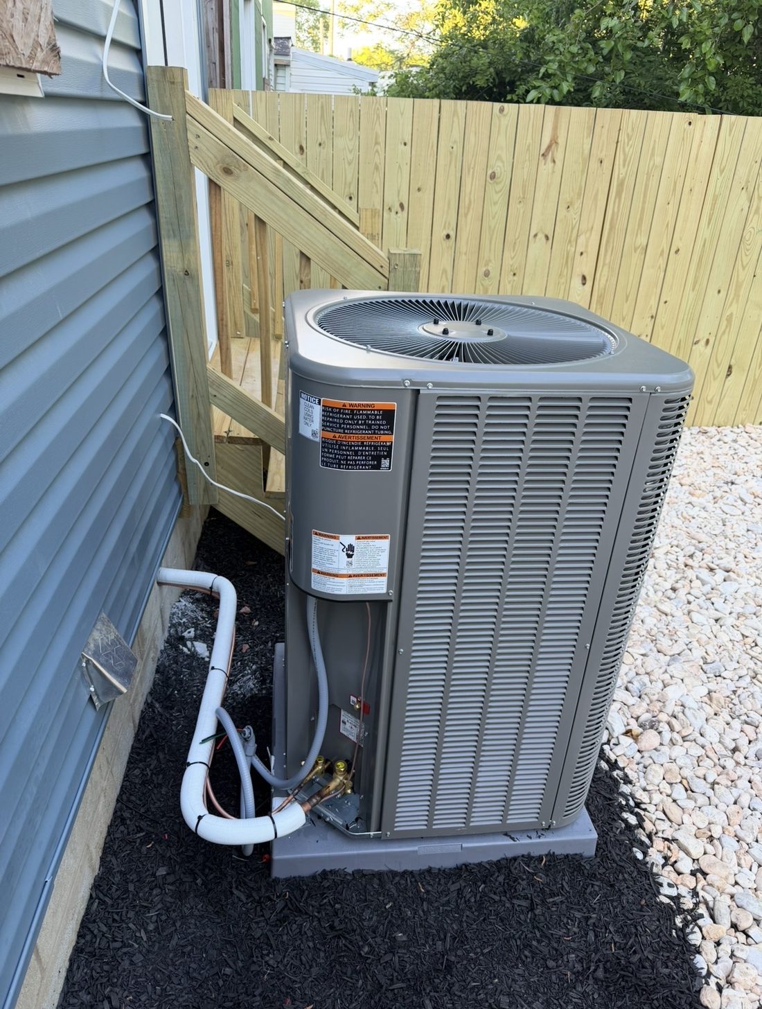 New Lennox air conditioning condenser installed beside a Philadelphia home