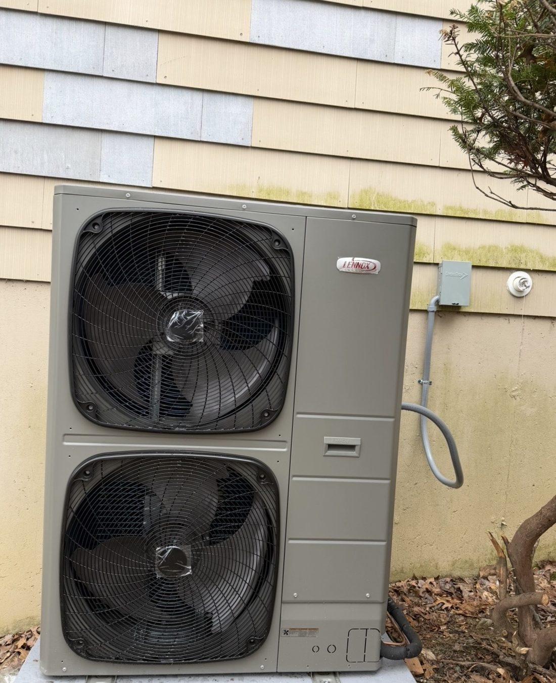 High-capacity Lennox dual-fan heat pump condenser installed by Lumen Heating and Cooling